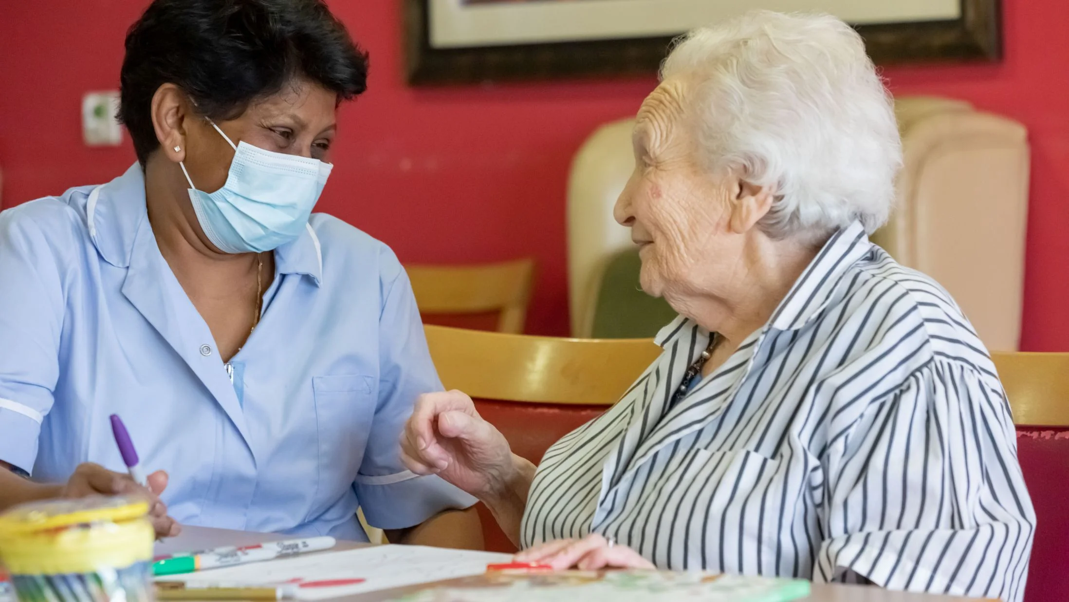 Otto Schiff care home resident with carer Otto Schiff care home resident with carer