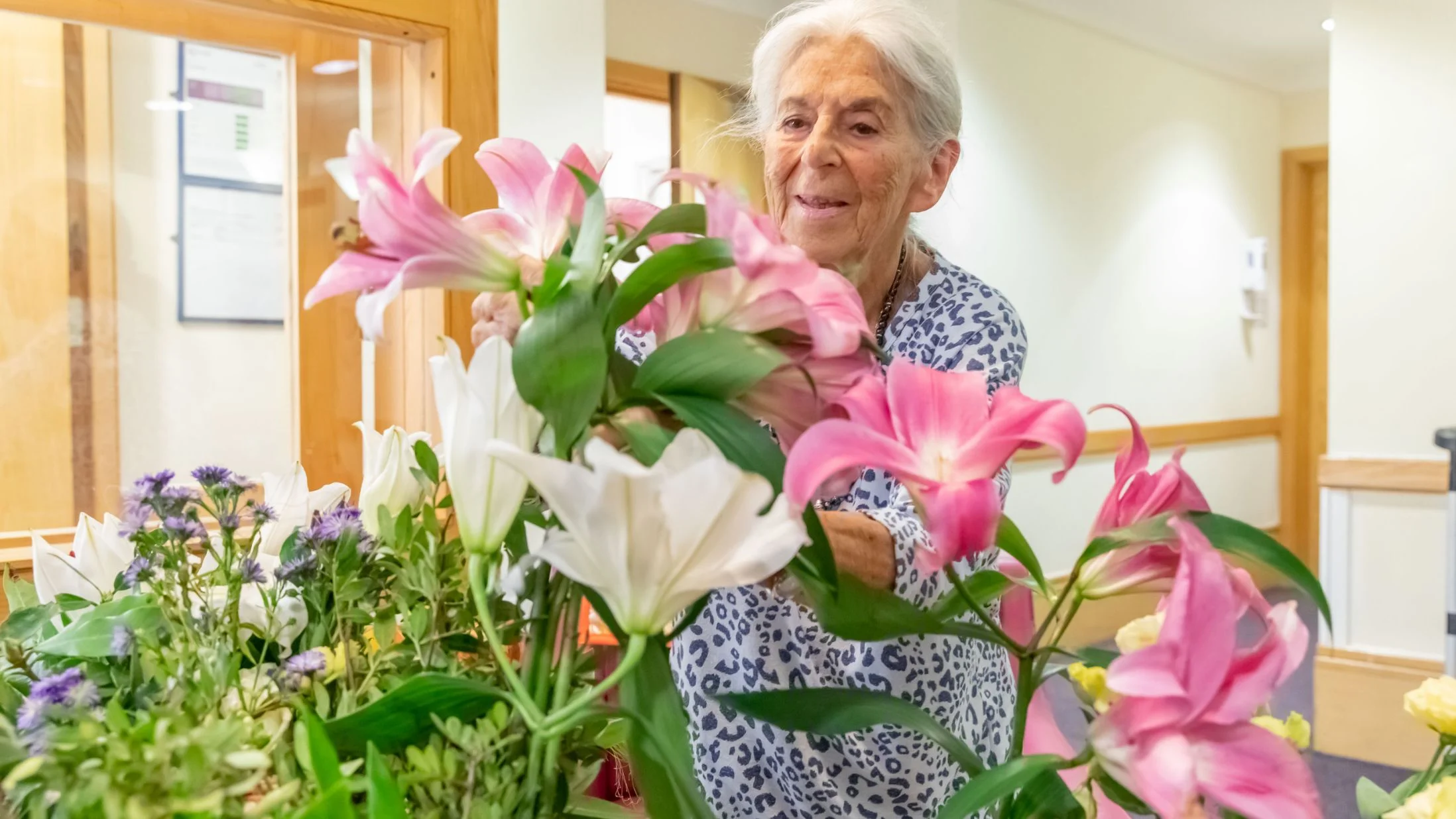 Rosetrees care home resident with flowers Rosetrees care home resident with flowers