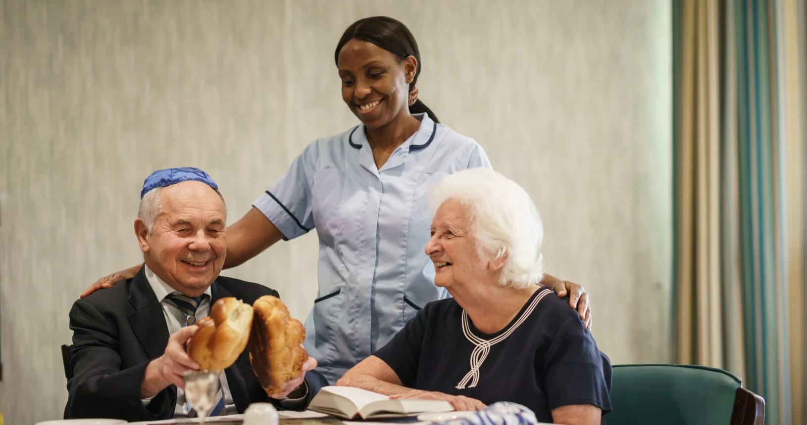 Jewish Care service users with a member of Jewish Care staff.
